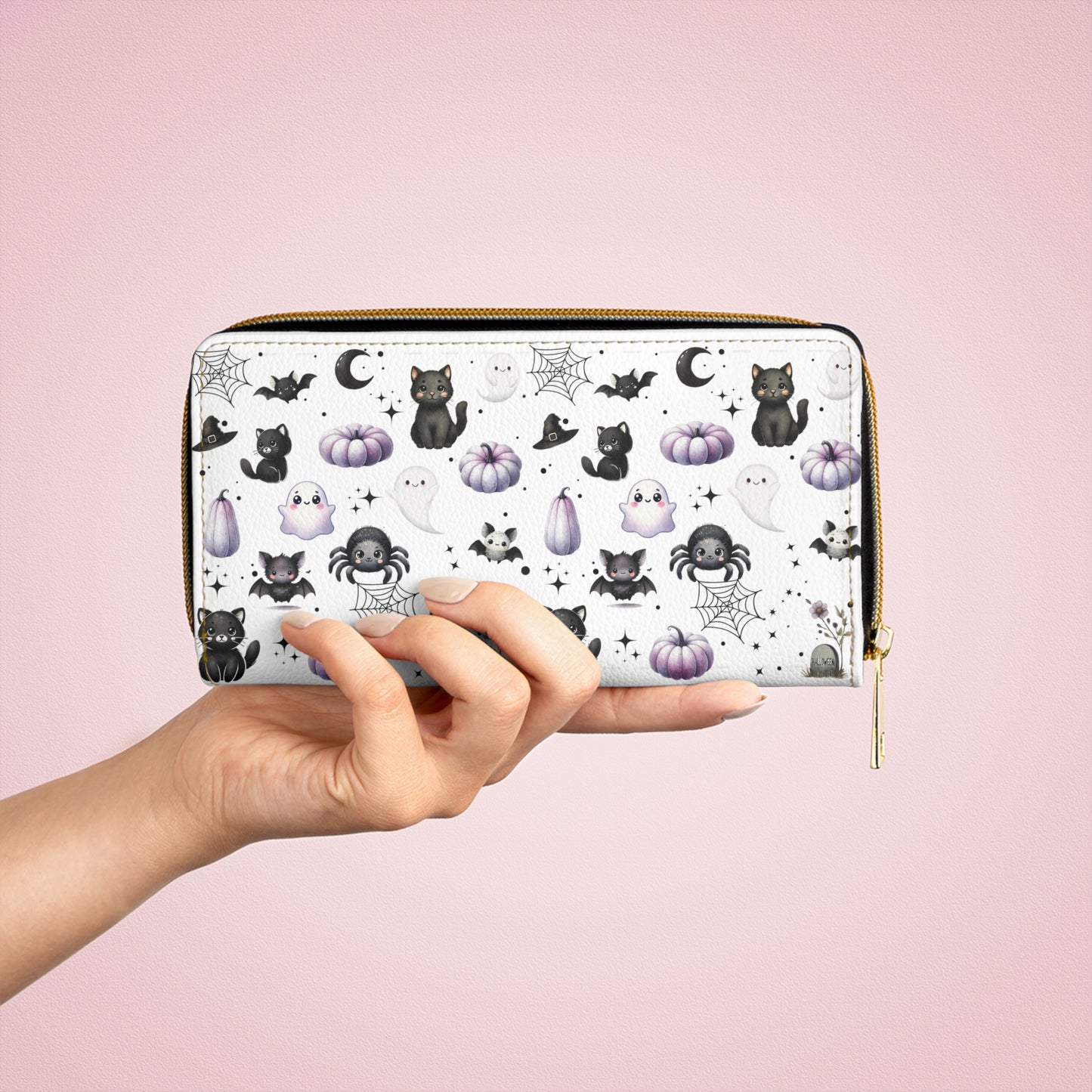 Cute Halloween Zipper Wallet with Black Cats, Ghosts, Bats and Spiders in someone's hand