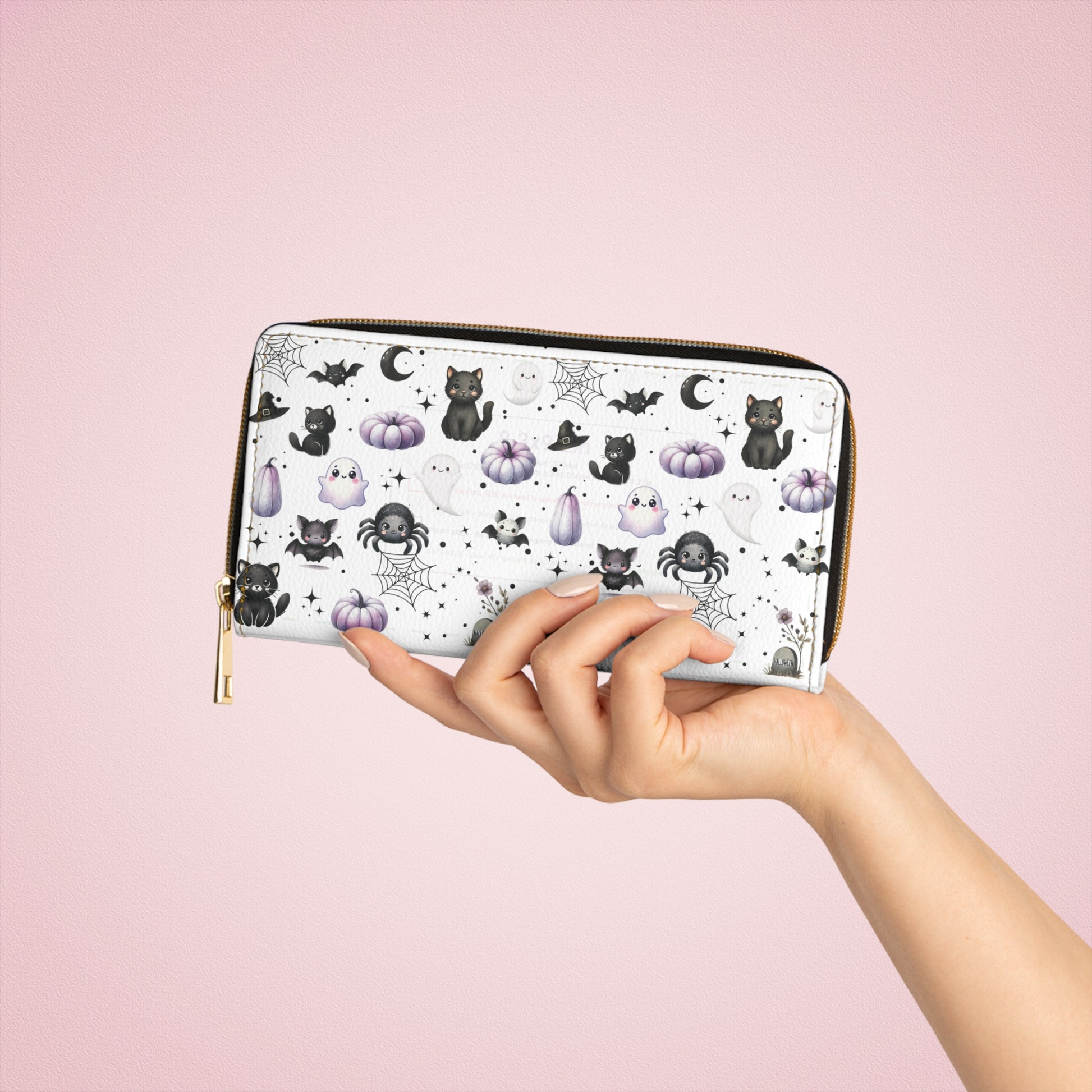 hand holding Cute Halloween Zipper Wallet with Black Cats, Ghosts, Bats and Spiders