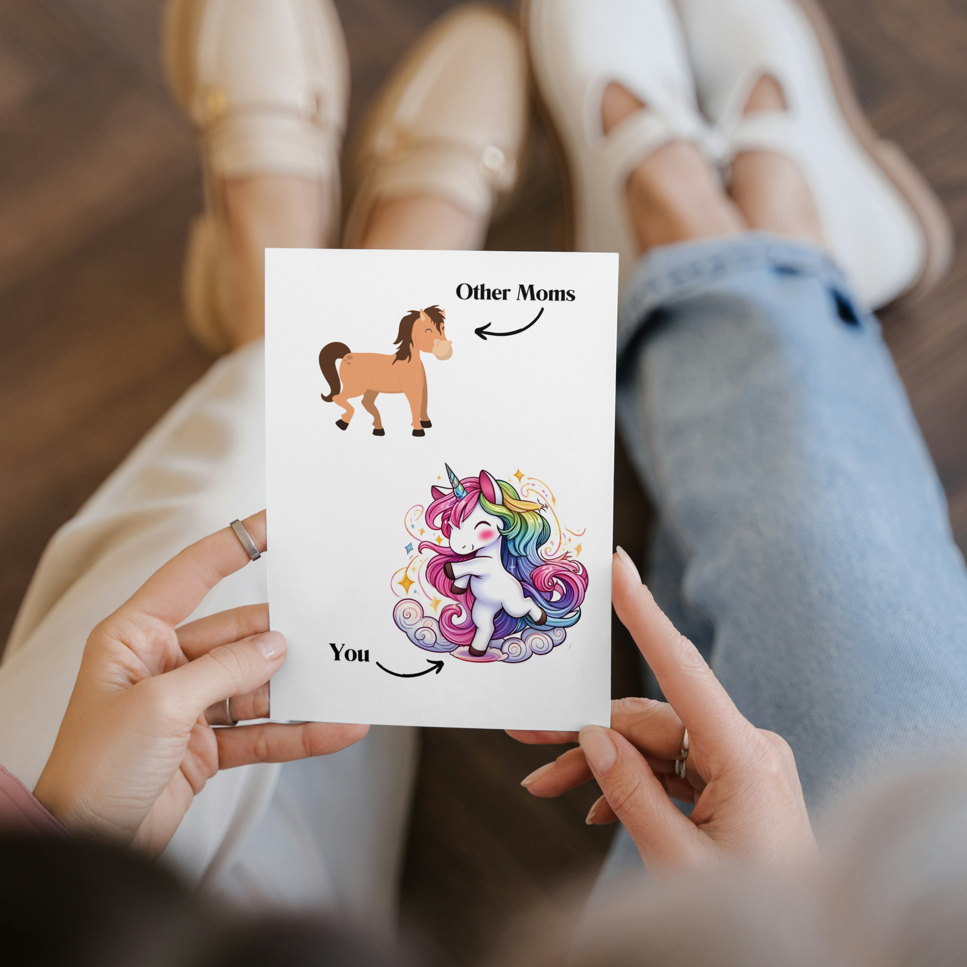 mom holding front of folded Funny Unicorn Mom vs Others Greeting or Mothers day Card