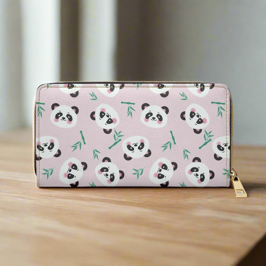 pink panda face zipper wallet on wood table
