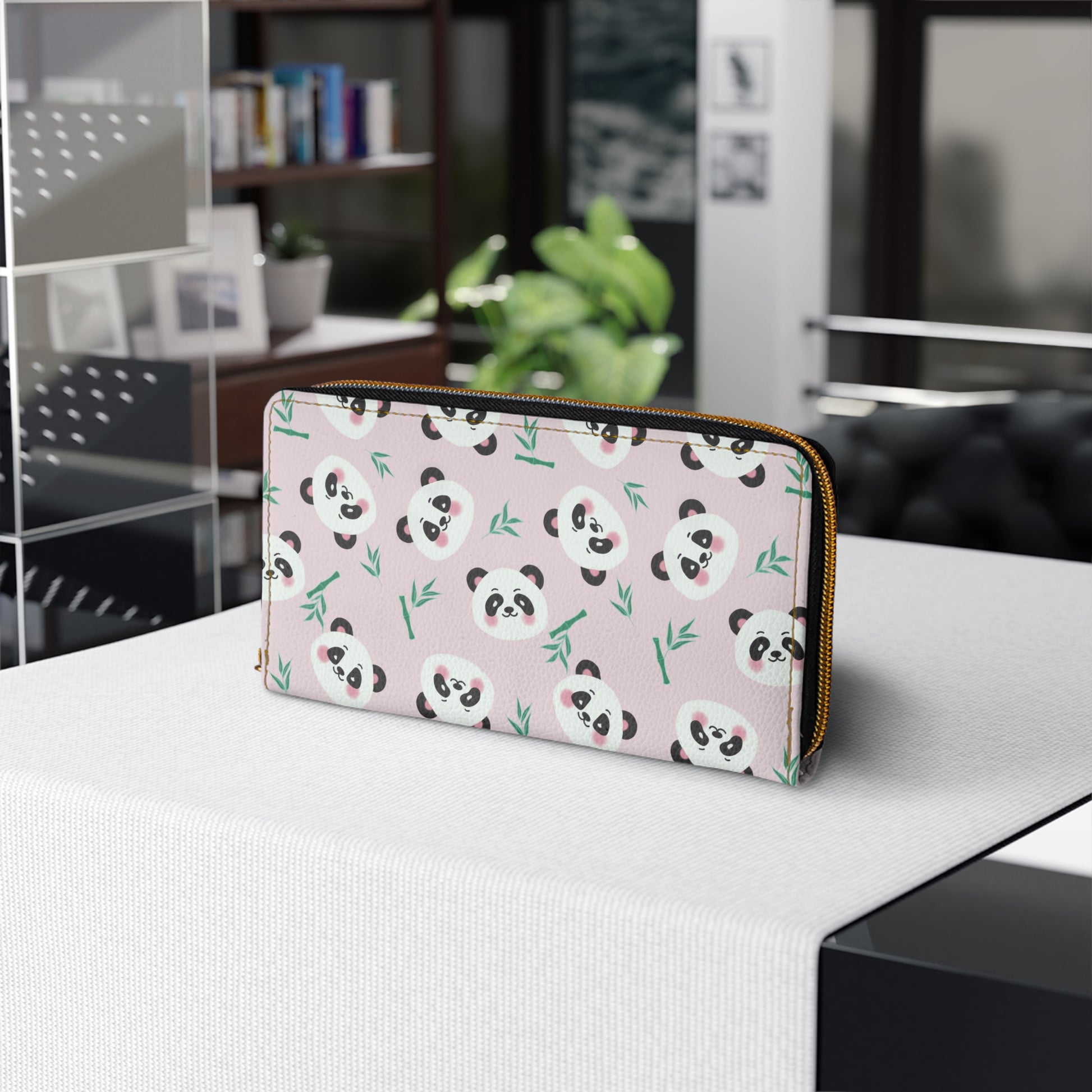 Pink Zipper Wallet with Cute Panda Faces on table