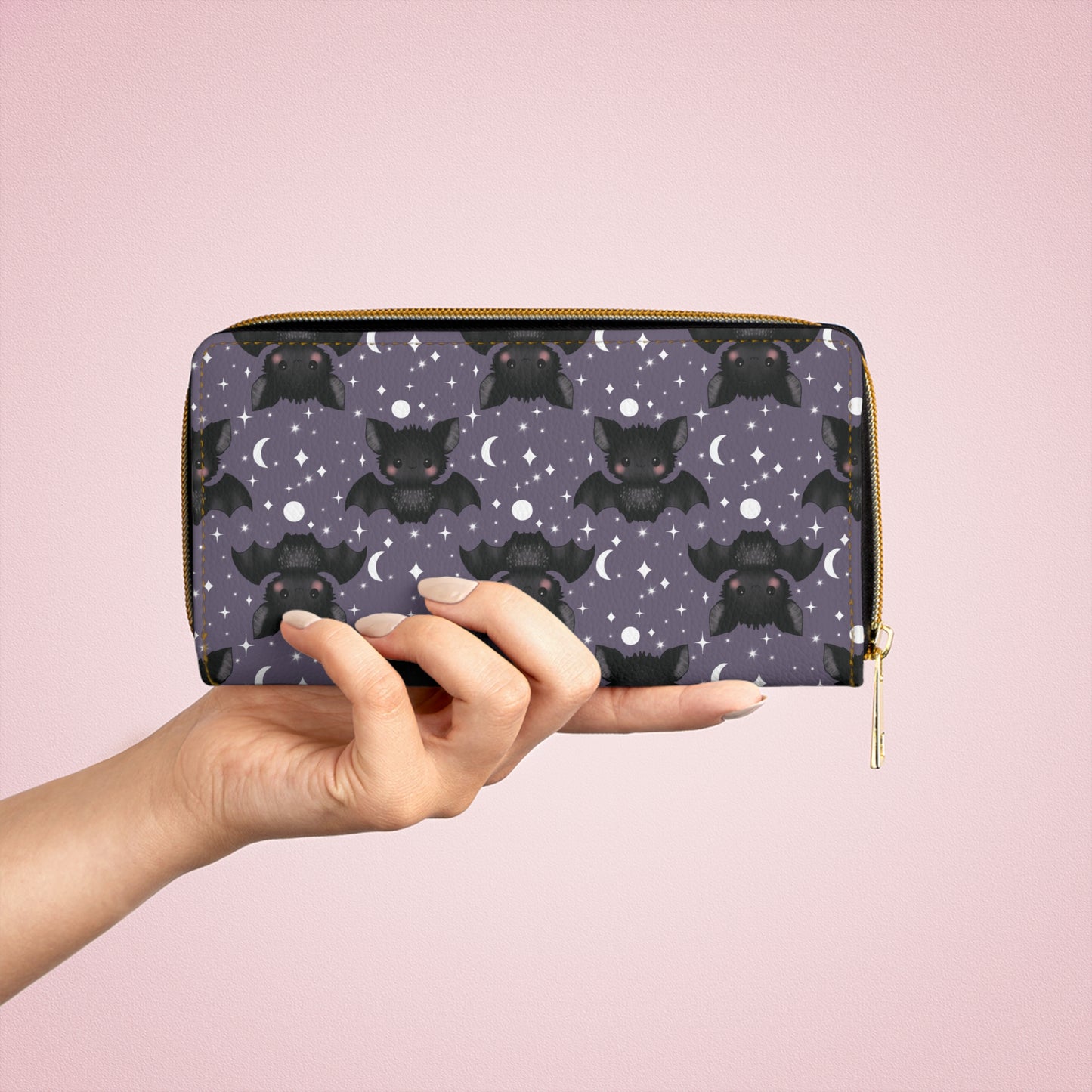 hand holding Purple Zipper Wallet with Cute Bats & Stars