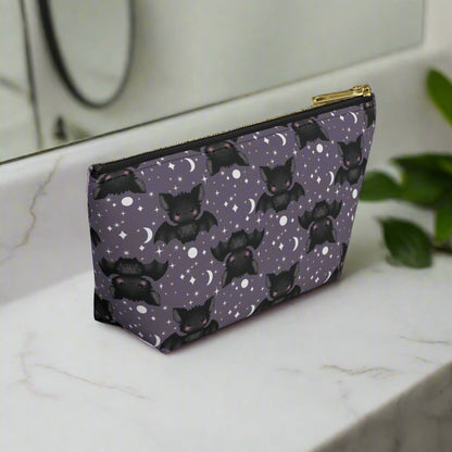 side view of smallCute Bats, Moon and Stars Accessory Pouch with T-bottom on bathroom counter